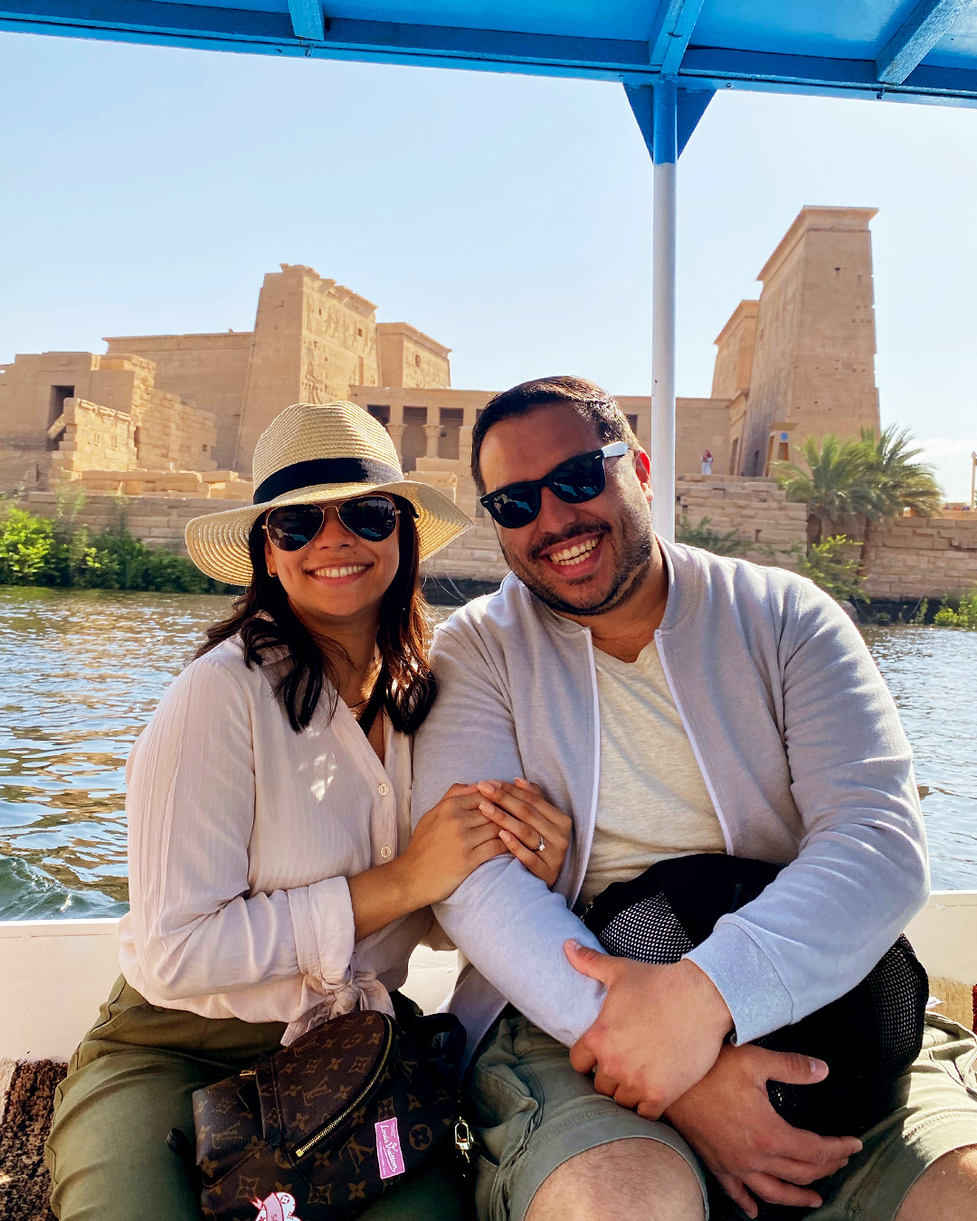 Couple traveling on felucca on the Nile river, Aswan Attractions