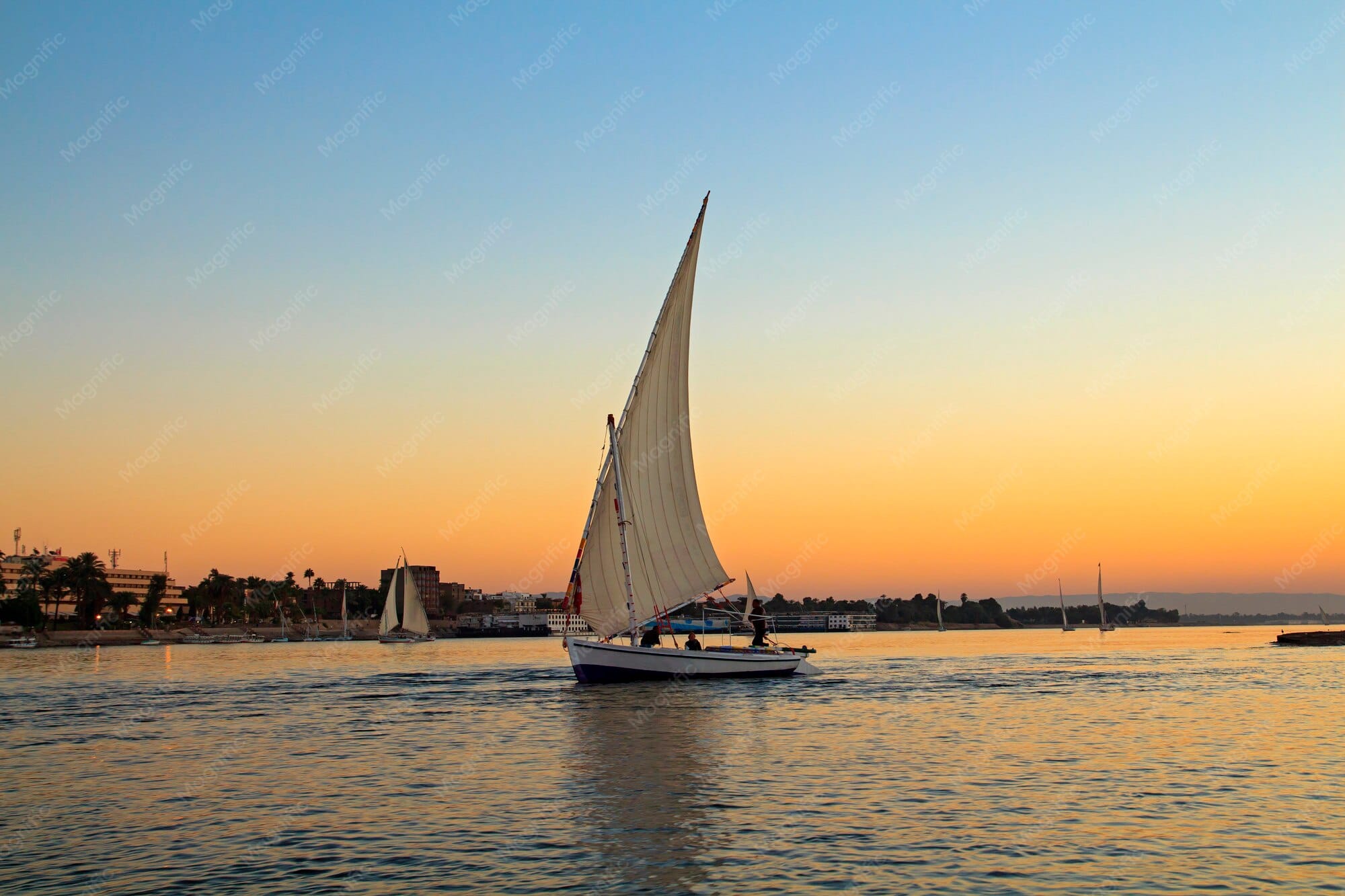 Sail boat on the Nile at sunset, Nile Valley